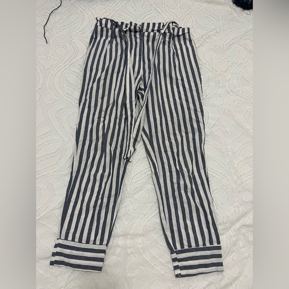 Blue and white striped linen pants with a paper bag waist and belt. - Picture 2 of 5